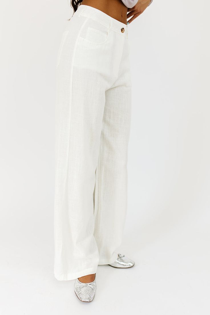 the perfect “go-with-anything” wide leg bottoms to elevate all of your summer outfit ideas. you can dress these off-white linen pants up or down for beach days, summer picnics, + date nights. off white // wide leg, one button zip fly, belt loops, pockets paired with our isabella top model is 5'10" + wearing a small measurements are approximate + taken while laying flat small : waist 26” inseam 30.5” length 42” medium : waist 28” inseam 31” length 42.5” large : waist 30” inseam 31” length 43" mor Chic Off White Cotton Wide Leg Pants, White Linen Pants For Spring, Chic Linen Wide Leg Pants For Day Out, Chic White Wide Leg Pants For Summer, Off White Wide Leg Pants For Spring, White Linen Wide Leg Vacation Pants, White Linen Wide Leg Pants For Vacation, White High-waisted Linen Pants, White Linen High-waisted Pants