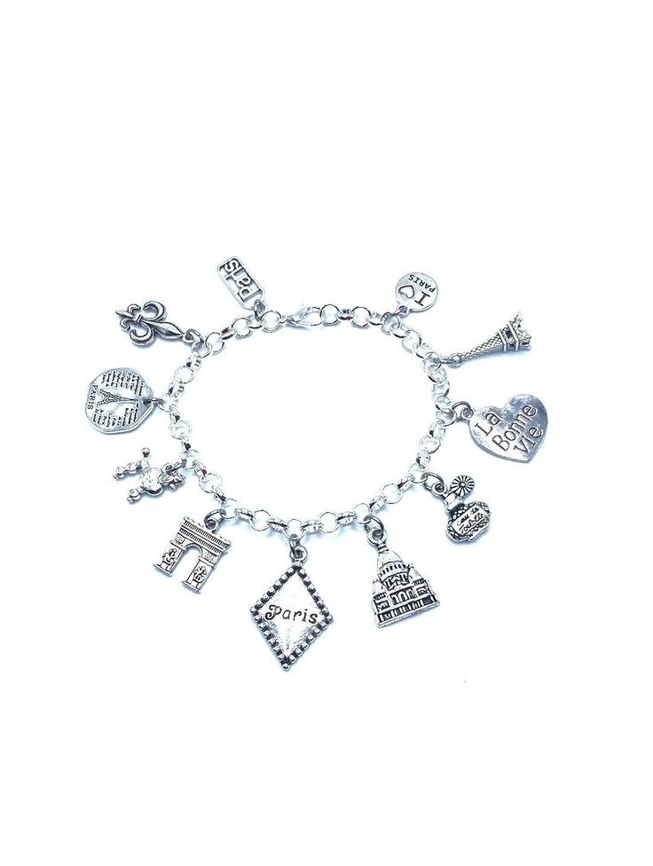 New. This Bracelet makes a perfect gift  has 11 Paris themed Charms.  Stainless Steel bracelet has a lobster clasp closure measures approx 8" bracelet and charms are silver tone alloy and steel. Charms measure approx 1/2" - 1" in size charms include assorted Paris, Fleur de Lis, Paris Eiffel Tower, Poodle, Arc de Triumph, Paris, Sacre Coeur Church, perfume, La Bonne Vie, Eiffel Tower, I love Paris Symbolic Metal Charm Bracelet With Dangling Charms, Adjustable Silver Charm Bracelet With Removable Charms, Nickel Free Silver Themed Charms, Nickel-free Themed Silver Charms, Nickel-free Silver Themed Charms, Adjustable Nickel-free Silver Charms, Themed Silver Metal Charms, Silver Metal Charm Bracelet With Lobster Clasp, Nickel-free Metal Charm Bracelet For Gift