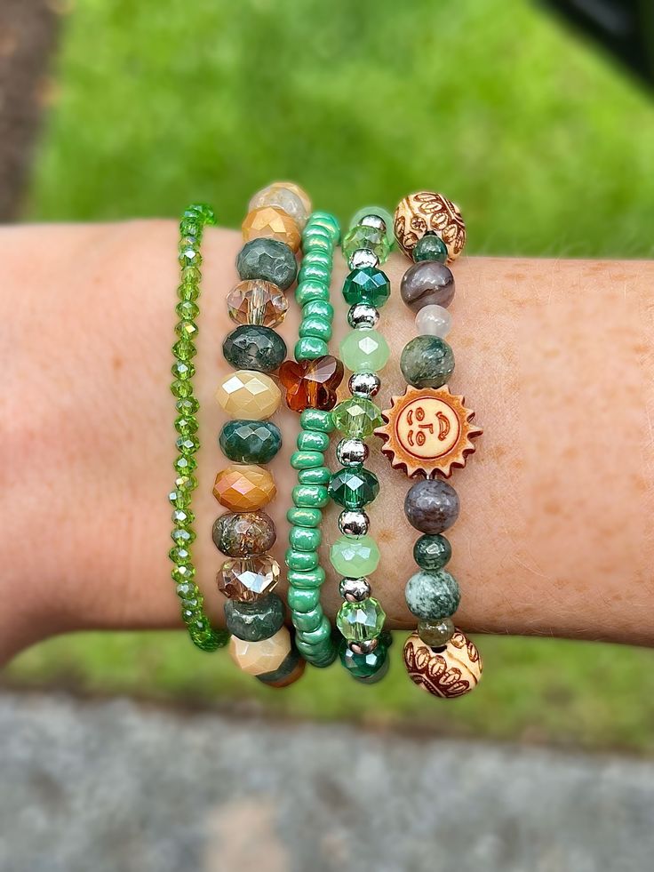 "Meet the Green and Brown Boho Bracelet Pack! ❀ How it's made: - You will receive five (5) bracelets - All bracelets are handmade - 7\" stretchy cord - Glass seed beads and moss agate crystals" Green Crystal Bracelet, Beaded Bracelets Handmade, Stackable Beaded Bracelets, Bracelet Pack, Hippie Bracelets, Boho Bracelet, Stretchy Bracelets, Agate Crystal, Green Crystal