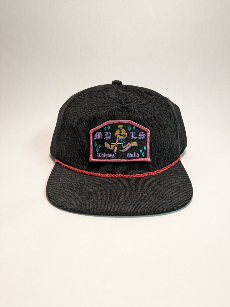 The perfect hat for lovers of Minneapolis, crime, and embroidered patches! Rope is braided by hand and components are hand-stitched. Help support a local Twin Cities artist. Adjustable Black Hats With Patches, Black Adjustable Hat With Patches, Adjustable Black Hat With Patches, Adjustable Patches Hat For Streetwear, Adjustable Streetwear Hats With Patches, Adjustable Black Hat With Embroidered Patch, Black Adjustable Hat With Embroidered Patch, Adjustable Hats With Patches For Streetwear, Trucker Hat With Embroidered Patch Curved Brim