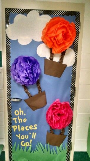 a door decorated with paper flowers and the words oh, the places you'll go