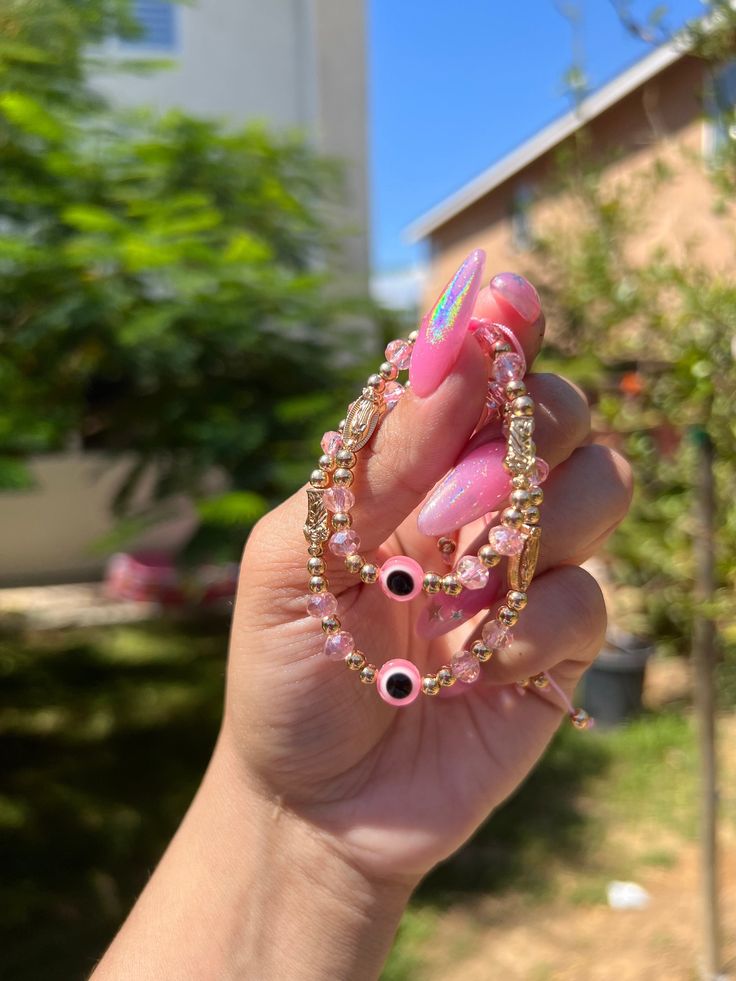 "Pink Evil Eye 🧿 Beaded Bracelet for Mom and Daughter In many cultures, it is believed that evil eye bracelets protect against misfortune, evil looks and negative energy. Wear your bracelet for good luck and protection. ✨ Pink Evil eye protects your friendships and exhibits a calming, relaxing feeling. ✨ *Listing is for one adult size bracelet and a kid size bracelet* The child bracelet fits a 4\" wrist at its smallest setting. It will adjust to fit most children's wrists. The child's arm in th Beaded Bangle Jewelry For Friendship, Pink Spiritual Charm Bracelet For Friendship, Handmade Spiritual Bracelets For Best Friend, Personalized Pink Spiritual Friendship Bracelets, Spiritual Handmade Bracelets For Best Friend, Handmade Jewelry For Best Friend Gift, Pink Resizable Round Bead Jewelry, Pink Charm Bracelet For Friendship With Lobster Clasp, Handmade Pink Beaded Bracelets For Best Friend Gift