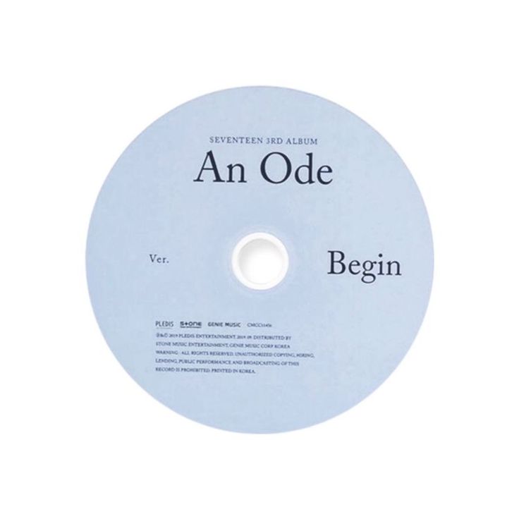 an olde cd disc with the words begin written in black and white on it