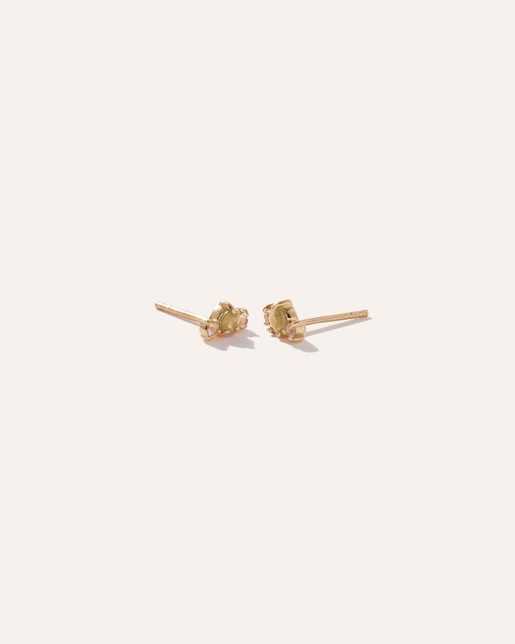 Minimalist design, maximum sparkle. Crafted in 100% recycled 18k gold vermeil and set with three mini gemstones, these studs are understated elegance designed to last. Try them solo for a simple statement or wear them stacked with multiple piercings. Dainty Adjustable Stackable Earrings, Dainty 14k Gold Stackable Earrings, Gold Gem Earring Stud, Tiny Yellow Gold Cubic Zirconia Earrings, Mini Earrings Stud Teal, Multiple Piercings, Aquamarine Colour, Silk Pillowcase, European Linens