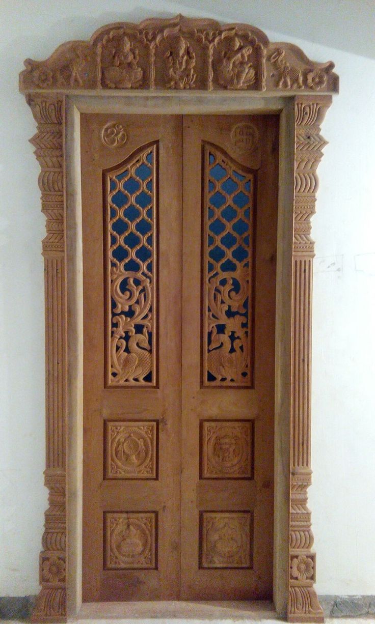 an intricately carved wooden door is shown