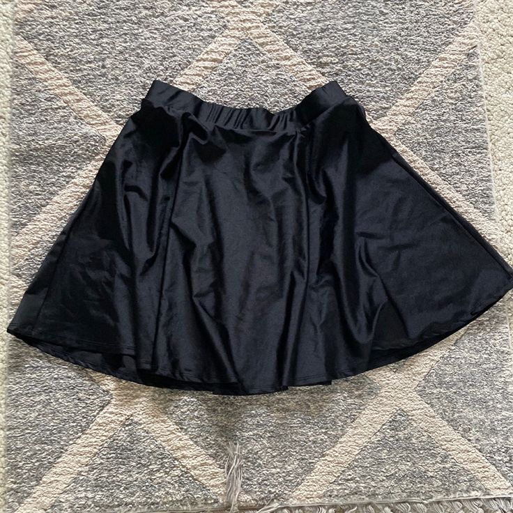 Short Flared Black Skirt. Pull On Style. Brand New Without Tags. Smoke Free Home. Large Black Skirt Workwear Halloween Costume Short Skirt Flared Skirt Barbie Party Mini Skirt With Elastic Waistband, Black Skirt For Spring Costume Party, Black Skirt For Costume Party In Spring, Black Flared Mini Skirt With Elastic Waistband, Mini Skirt With Elastic Waistband For Party, High Waist Stretch Swim Skirt For Party, Black Mini Skort With Gathered Skirt, Stretch Mini Skirt For Costume Party, Black Pleated Skirt For Costume Party