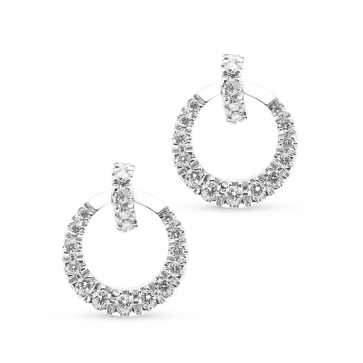 Bold and contemporary, these diamond drop earrings elevate your evening attire. Fashioned in 18K white gold, each luxe drop showcases an open circle -shaped dangle adorned in graduating round brilliant cut diamonds. A diamond pave lined huggie as the post. Captivating with 0.50 ct. t.w. of diamonds and a bright polished shine, these post earrings secure comfortably with friction backs.
0.50 carat 
14k white gold
The earring design can be customized to suit your part Modern Round Cut Halo Diamond Earrings, Modern Cubic Zirconia Earrings With Halo Design, Evening Round Halo Diamond Earrings, Modern Brilliant Cut Diamond Earrings For Evening, Modern Round Diamond Earrings For Evening, Modern Sterling Silver Diamond Earrings With Halo Design, Modern Round Brilliant Cut Earrings, Modern Brilliant Cut Round Earrings, Elegant Formal Circular Earrings