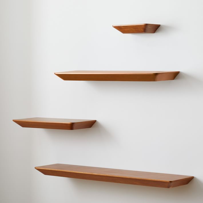 three wooden shelves mounted to the wall