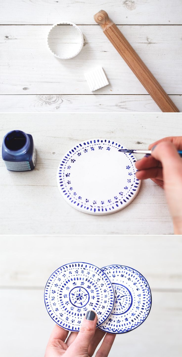 two plates with blue designs on them, one being painted and the other being decorated