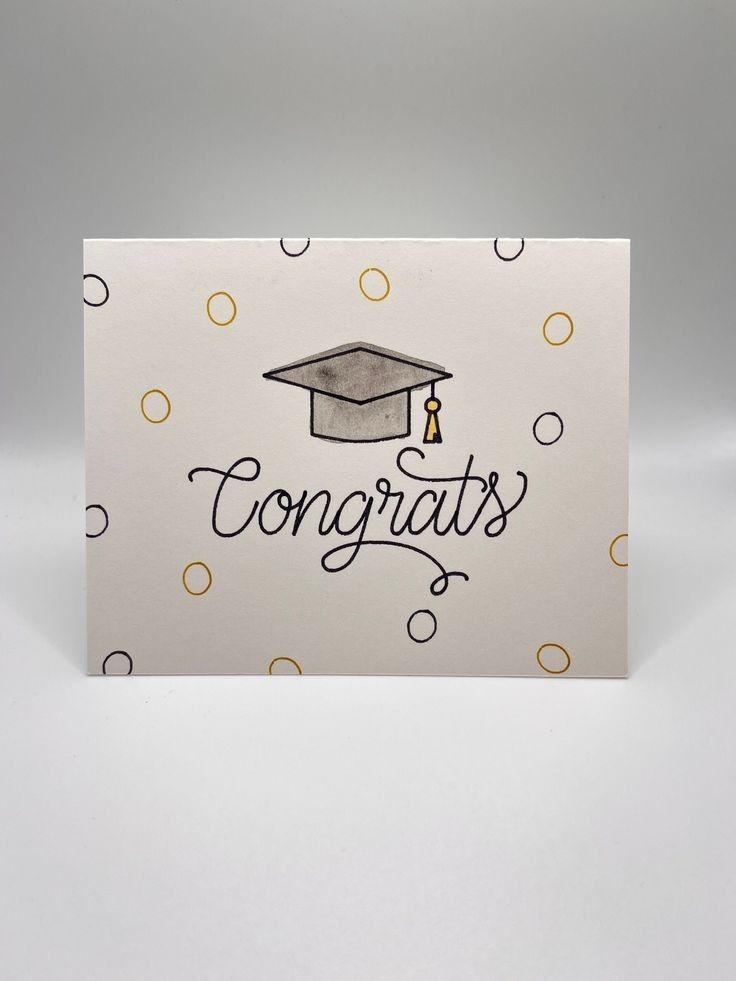 congratulations card with a graduation cap and polka dot pattern on the back that says congrats