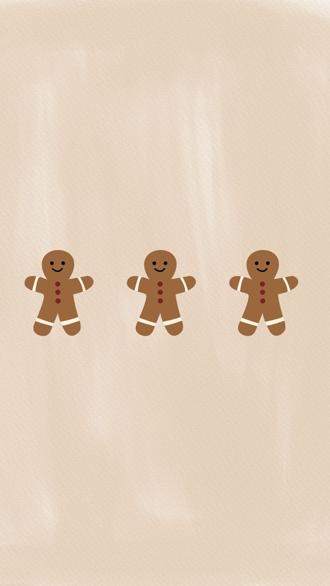 three gingerbread men standing next to each other