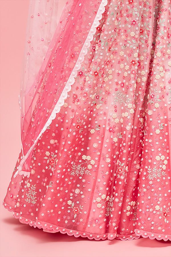 Editor's Note Rose Pink Nishat Bagh Embroidered Ombré Lehenga With Blouse And Dupatta Color: Pink Fabric: Lehenga & Blouse: Organza; Lining: Shantung; Dupatta: Tulle Care: Dry Clean Only About the Designer Nachiket Barve is an award-winning Fashion and Costume designer based in Mumbai, India. He is known for his eponymous label that celebrates Indian tradition with a contemporary and global outlook. Floral Embroidered Organza Lehenga For Navratri, Navratri Organza Lehenga With Floral Embroidery, Pink Organza Lehenga For Navratri, Pink Semi-stitched Choli With Floral Embroidery, Semi-stitched Pink Choli With Floral Embroidery, Pink Net Lehenga For Wedding, Pink Floral Embroidered Choli For Reception, Pink Lehenga With Floral Embroidery In Traditional Drape, Pink Floral Embroidered Sharara With Traditional Drape