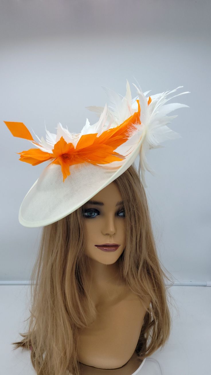 Beautiful ivory and orange wedding fascinator with coral flowers. Discretely secured with a headband elastic..It has an elegant a classy look. Great way to compliment your wedding,  bridal shower,  rehearsal dinner,  cocktail party, Esther or church outfits. Adjustable headband. Hair clip may be added - Rear Find - Ready to ship  - Lightweight - Fast shipping - Customize by adding different color flowers and or feathers Check my store for for styles and colors.  etsy.com/shop/hatsandpearls Find Orange Mini Hat For Kentucky Derby Races, Orange Headpiece For Kentucky Derby Races, Orange Headpieces For Kentucky Derby Races, Elegant Orange Fascinator For Wedding, Orange Fascinator Hat For Kentucky Derby, Orange Hat Fascinator For Races, Orange Fascinator For Kentucky Derby Races, Orange Kentucky Derby Fascinator Hat, Orange Wedding Hats For Spring