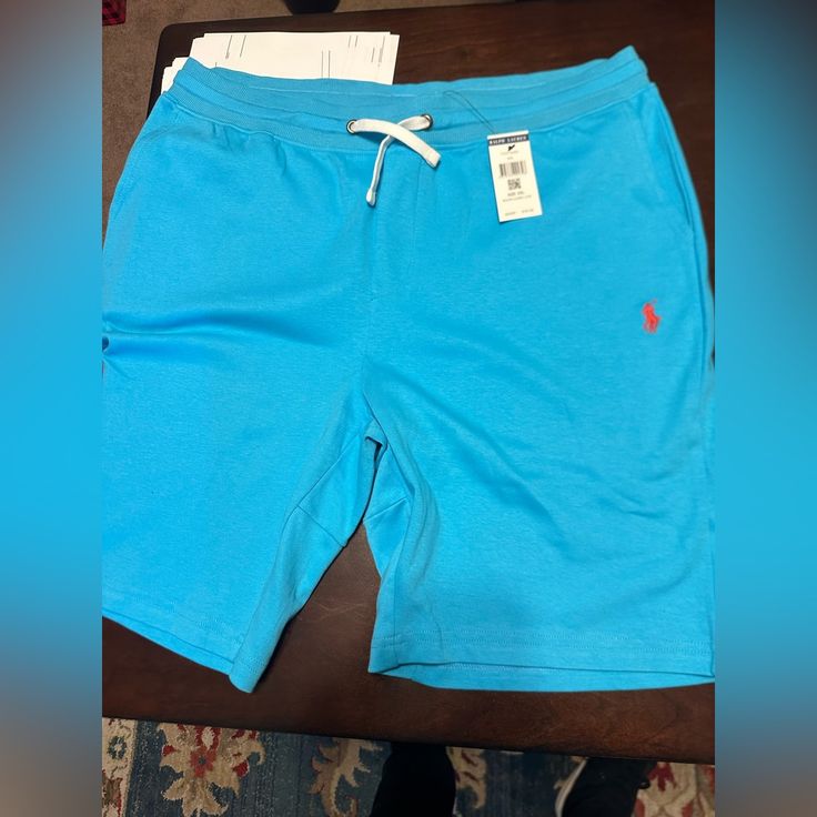 Polo Shorts Blue Bermuda Bottoms With Elastic Waistband, Blue Bermuda Shorts With Relaxed Fit, Casual Blue Shorts, Casual Blue Bottoms With Short Leg, Casual Blue Short Leg Bottoms, Casual Blue Short-leg Bottoms, Casual Blue Shorts For Loungewear, Casual Blue Loungewear Shorts, Khaki Shorts Men