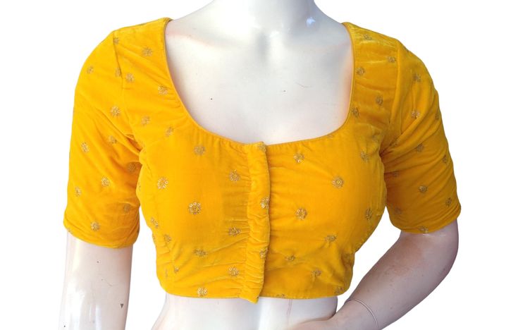 Discover exquisite Yellow Saree Blouses, luxurious Velvet Readymade blouses, and stylish Indian Saree Choli tops in the USA. Elevate your ethnic wardrobe with our curated collection of high-quality designs Made of Velvet Fabric lined with Cotton Size: 36,38,40 Sleeve Length: 10 Inches Blouse Length: 15 Inches Neck Depth:     Front: 7.5 Inches,     Back: 9.5 Inches, Padded Blouse, (Pads can be removed upon request) Order Will be shipped through INDIA POST Delivery time will be 7 to 15 working day Yellow Saree Blouse, Blouse Indian Saree, Blouse Indian, Padded Blouse, Yellow Saree, Saree Blouses, Readymade Blouse, Indian Saree, India Post