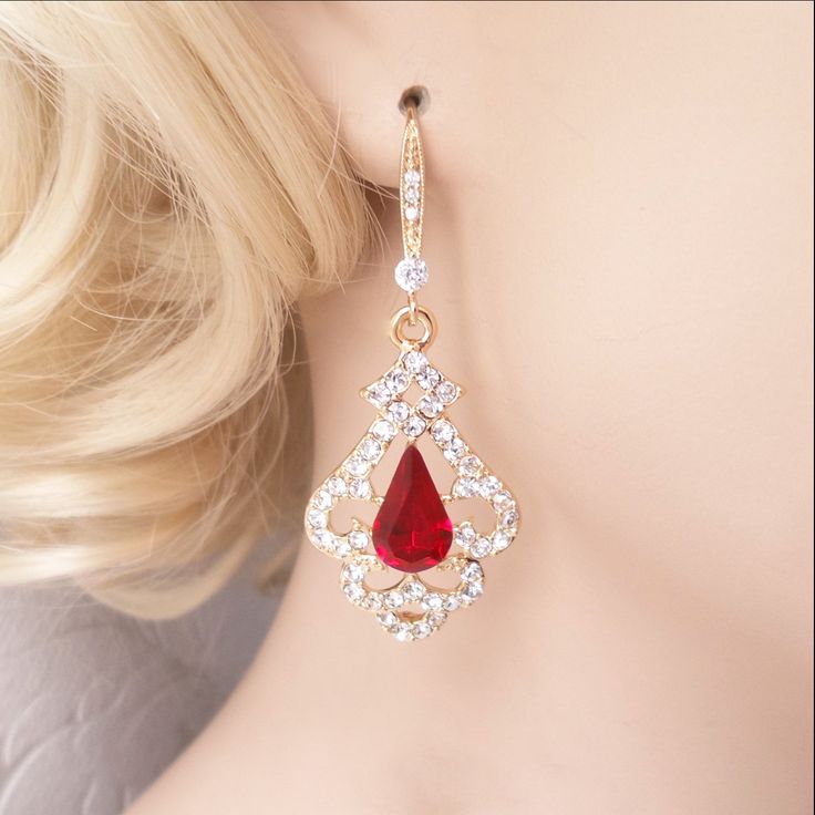 "Elegant Victorian inspired drop earrings, pendant, or necklace set with ruby red Swarovski crystal center jewels bordered by swirls of pave set clear diamante. The metal is nickel-free with your choice of rose gold, silver, or gold plating. The earrings are 2\" (5 cm) long and .8\" (2cm) wide. The pendant is 1.5\" long on a chain that is adjustable from 16\"-18\" long. Ships quickly in a free gift box! I stock Swarovski crystals in the full rainbow of colors and can customize this design in man Elegant Red Dangle Jewelry, Crystal Jewelry For Wedding And Valentine's Day, Glamorous Valentine's Day Jewelry For Formal Occasions, Elegant Ruby Jeweled Jewelry Sets, Elegant Ruby Jewelry Set, Elegant Ruby Jewelry Sets With Jewels, Elegant Red Jewelry With Matching Earrings, Red Drop Earrings For Wedding, Elegant Red Jewelry For Anniversary