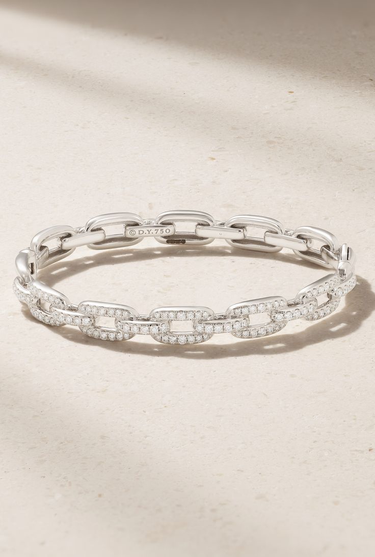 Inspired by a background in sculpture and painting, David Yurman's co-founders describe their jewelry collection as "one long art project." This 'Stax' chain link bracelet is crafted from 18-karat white gold and studded with 1.22-carats of sparkling pavé diamonds. Luxury Diamond Link Bracelet For Anniversary, Luxury Link Diamond Bracelet For Anniversary, Elegant White Chain Bracelet With Solid Link, Designer White Gold Diamond Bracelet For Formal Events, Designer White Gold Diamond Bracelet For Formal Occasions, Elegant White Chain Bracelet, Elegant White Bracelet With Solid Link Construction, Formal Diamond Bracelet With Rectangular Links, Contemporary White Gold Diamond Jewelry