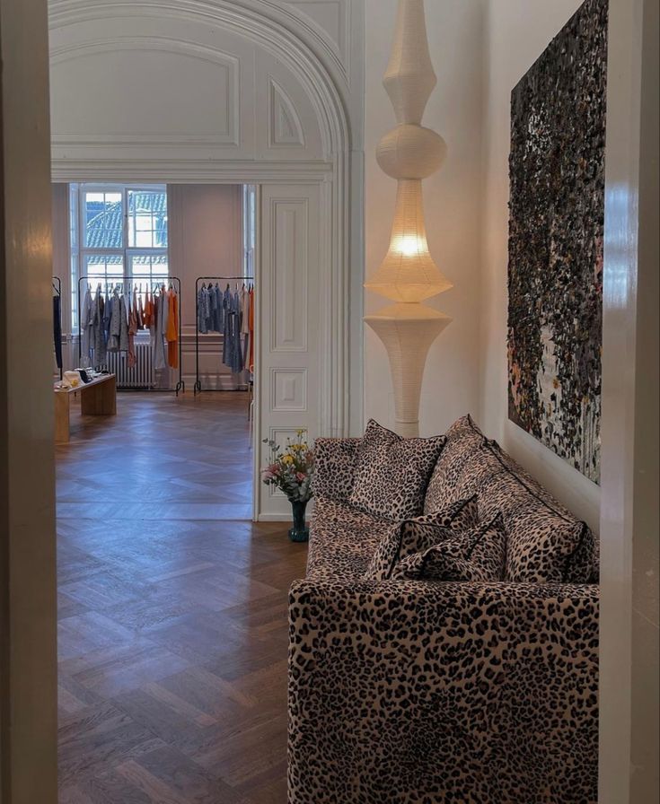 a living room filled with furniture next to a doorway