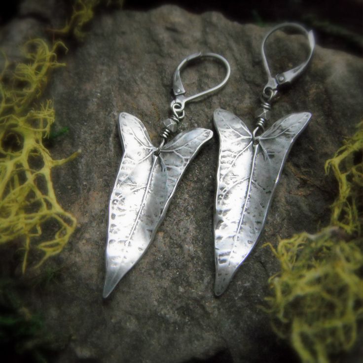 "These fine silver (99.9% pure silver) earrings are made with real vine leaves that I have found in my garden. The beauty of nature is captured in silver, each one is unique just like the leaves they are made from. Wear these beautiful woodland leaves to show your love of nature! These earrings hang a little over two inches long in total length (approx 52mm). varying very slightly depending on the leaf used to make it. All other components are sterling or fine silver. If you would prefer these e Handmade Leaf-shaped Earrings, Unique Nickel-free Leaf-shaped Earrings, Nickel-free Leaf-shaped Nature-inspired Earrings, Silver Leaf-shaped Handmade Earrings, Nature-inspired Leaf-shaped Jewelry With Matching Earrings, Metal Leaf-shaped Earrings As Gift, Leaf-shaped Metal Earrings As Gift, Leaf-shaped Jewelry Gift, Handmade Nature-inspired Silver Earrings