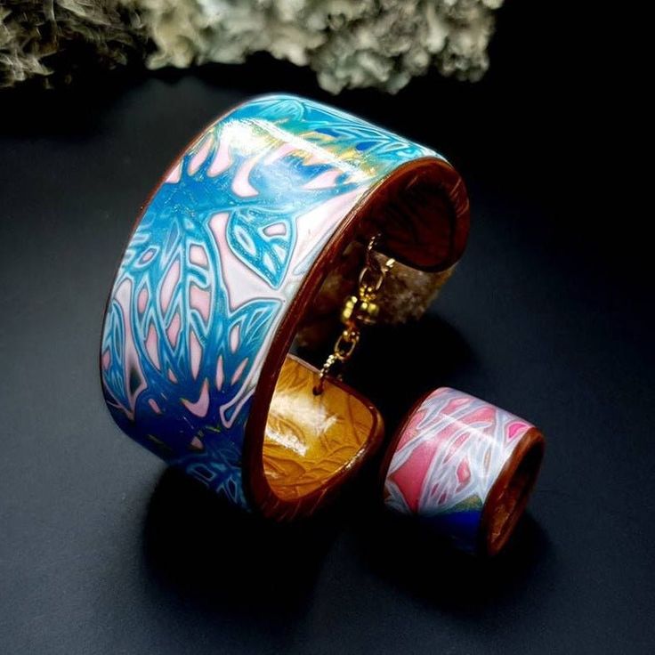 Unique handmade one-of-a-kind "Bracelet Cuff and Ring." Explore my exquisite Polymer Clay Jewelry Sets, featuring unique combinations to suit any style. Each set can include earrings and necklaces, earrings and pendants, or rings and pendants, offering diverse options. Crafted with attention to detail and vibrant colors, these sets are perfect for expressing your style or gifting to someone special. Whether you want to complete an outfit or find a thoughtful present, my polymer clay jewelry sets Hand Painted Gold Bracelet, Unique Jewelry Sets As Gifts, One Of A Kind Multicolor Jewelry Bracelet, One Of A Kind Multicolor Bracelet, Hand Painted Gold Jewelry Wearable Art, Bohemian Hand-painted Bangle Jewelry, Hand Painted Bohemian Bangle Jewelry, Bohemian Hand Painted Bangle Jewelry, Bohemian Hand Painted Bracelet Jewelry