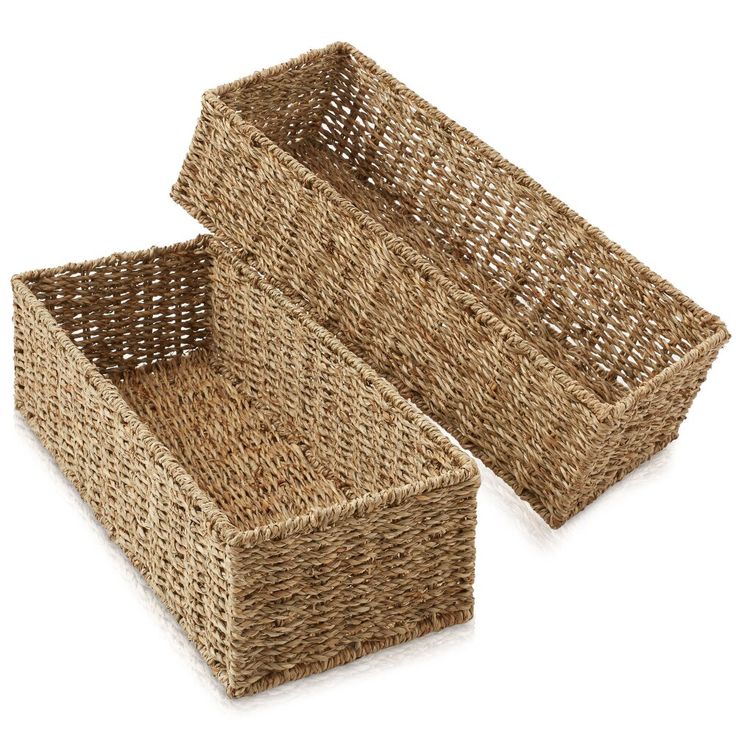 two wicker baskets sitting next to each other