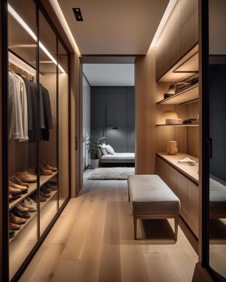 a walk - in closet with wooden shelves and shoes on the floor next to it