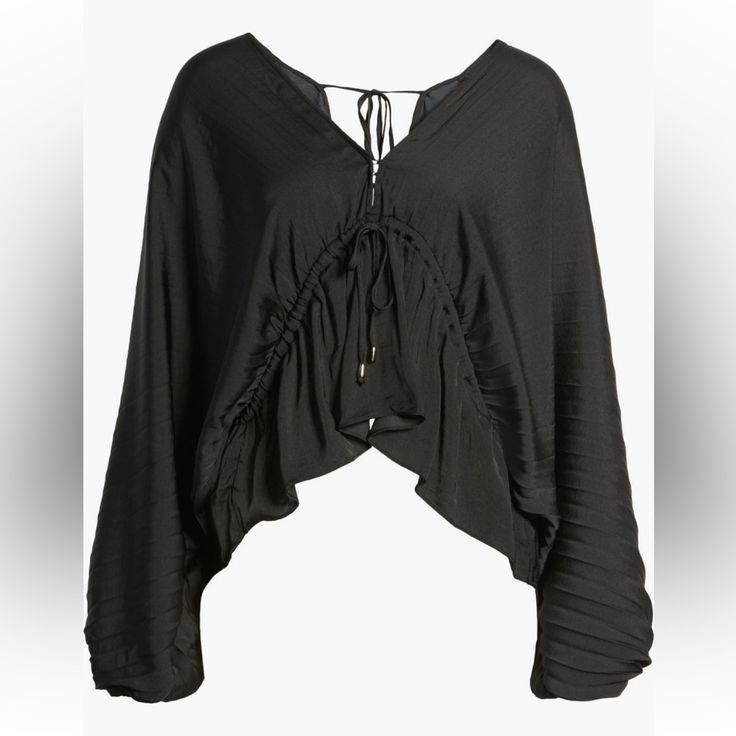 Meet Friends For Lunch Or Enjoy A Picnic In The Park With Style Wearing This Lightly Textured Blouse With A Flouncy High/Low Hem And Billowy Balloon Sleeves. Size: Small 18" - 20" Length Ties At Back V-Neck Long Sleeves 100% Polyester Hand Wash, Dry Flat #240637 Black Blouse For Spring Vacation, Black Spring Vacation Blouse, Elegant Viscose Tops For Beach, Black V-neck Blouse For Day Out, Black V-neck Blouse For Vacation, Versatile Black Viscose Blouse, Chic Black Vacation Blouse, Chic Black Blouse For Vacation, Black V-neck Blouse For Beach