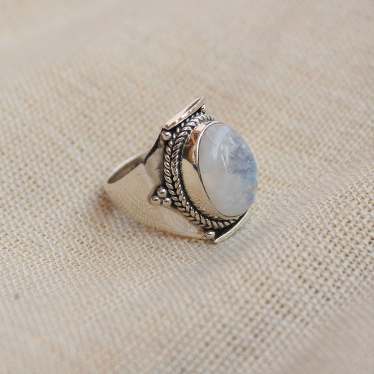 Gemstone - Natural Rainbow Moonstone Gemstone Size - 10x14 mm oval Metal - Sterling Silver natural AAA rainbow moonstone set with a sterling silver handmade ring Each Ring made with Precision and love, these rings are perfect for everyday use and a perfect accessory to wear at work. Rings can be customized on request and gemstone can be switched to any other as per requirement. Other beautiful designs uploaded with fabulous gemstones. kindly visit my store to view the complete collection. Feel f White Moon Shaped Opal Ring For Gift, White Moonstone Gift Ring With Round Stone, White Moonstone Open Ring Jewelry, White Moonstone Ring Gift, White Moon Shaped Opal Ring Gift, White Moon-shaped Opal Ring Gift, White Natural Stones Jewelry For Promise Ring, Silver Moon-shaped Moonstone Ring Gift, White Opal Moon Shaped Ring With Gemstone