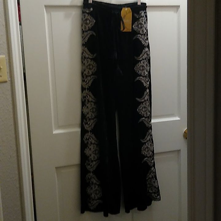 Beautiful Pair Of Black Velvet Pants With Ivory Embroidery Down The Sides Of The Legs From Waist To Hem At The Bottom. They Are Brand New With The Tag, Size Small. They Have An Elastic Waistband With A Velvet Tie At The Waist. Very Soft, And Gorgeous! Fitted Floral Embroidered Long Pants, Fitted Floral Embroidery Long Pants, Embroidered Wide-leg Party Pants, Fitted Embroidered Long Pants, Party Wide Leg Embroidered Pants, Fitted Embroidered Long Bottoms, Party Wide-leg Embroidered Pants, Party-style Embroidered Wide-leg Pants, Elegant Embroidered Black Bottoms