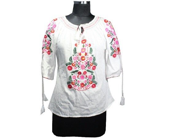 Colour : White Top with floral embroidery  Its a beautiful Women Top which fits to Size - XS,S  Chest- 38'' Length-21 inch '' Fabric : 100% Cotton Breathable Fabric, very soft and comfortable Top. It's a super breathable and soft cotton shirt, light weight, coat collar front vintage slim fit tunic classic top. Occasion : Perfect for your daily wear, outdoor activity, dates and parties....And your occasion is perfect in spring, summer and fall. 💖 Care and love To preserve the allure of this mast Spring Short Sleeve Blouse With Resham Embroidery, Spring Folk Embroidered Top With Floral Embroidery, Spring Peasant Top With Multicolor Intricate Embroidery, Traditional Spring Peasant Top With Embroidered Neckline, White Folk Style Top With Resham Embroidery, White Folk Style Embroidered Top With Resham Embroidery, Traditional Blouse With Resham Embroidery For Spring, Traditional Floral Embroidered Top For Spring, Traditional Spring Tops With Intricate Embroidery