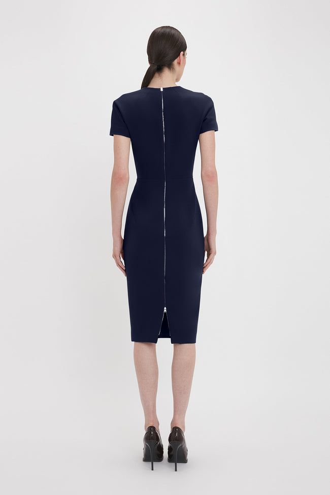 Relaxed but glamorous T-shirt dresses are foundational pieces in the Victoria Beckham archive. Crafted from a stretch double wool crepe and lined in stretch jersey, the Classic T-Shirt Fitted Dress is a signature piece in the Victoria Beckham archive. Presented in a regal shade of Ink Blue for the new season, it has a modest round neckline, short sleeves and a midi-length hem for understated sophistication. Double-ended exposed metal zips at the back add a contemporary point of difference. Victo Wool Crepe, Ink Blue, Shirt Dresses, Blue Ink, Victoria Beckham, Fitted Dress, New Season, T Shirt Dress, Midi Length