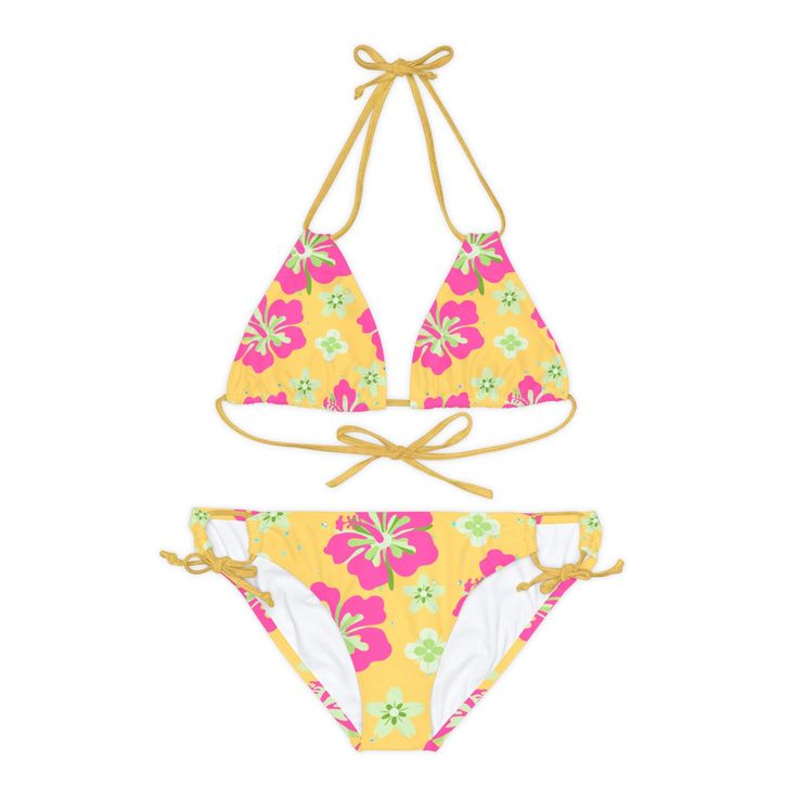 Get ready to turn heads with our stunning Hawaiian Hibiscus Strappy Bikini Set. This eye-catching bathing suit features a vibrant yellow base adorned with pink hibiscus flowers, inspired by the beauty of tropical paradise. Designed for both comfort and style, this two-piece swimsuit is made from a high-quality blend of microfiber polyester and spandex. The material is soft, stretchy, and quick-drying, ensuring a comfortable and enjoyable swim. The bikini top is crafted with adjustable elastic st Cheap Pink Tropical Swimwear, Cheap Hawaiian Style Swimwear, Cheap Hawaiian Swimwear For Summer, Cheap Tropical Floral Print Swimwear, Affordable Yellow Tropical Swimwear, Hibiscus Flower Bikinis, Hibiscus Print Beach Party Swimwear, Hibiscus Print Swimwear For Beach Party, Hibiscus Print Beachwear For Beach Party