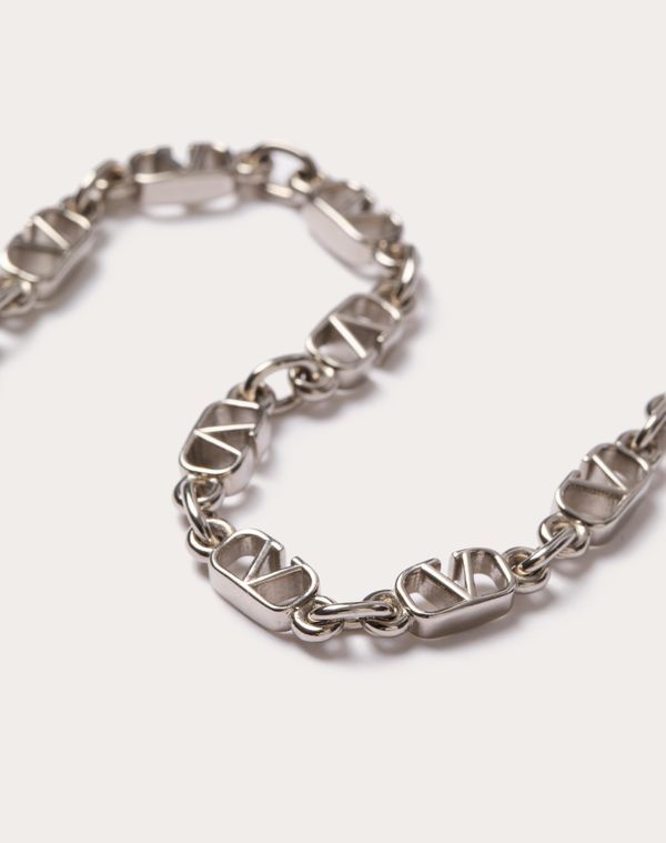 Valentino Garavani metal VLogo Signature bracelet -Palladium colour finish -VLogo dimensions: 0.8 x 0.5 cm / 0.3 x 0.2 in. -Available in sizes: S - 19.5 cm / 7.7 in., M - 20.5 cm / 8.1 in., L - 21.5 cm / 8.5 in. -Snap hook closure -Made in Italy Luxury Everyday Sterling Silver Bracelet In White Gold, Classic Metal Jewelry With Logo Charm, Luxury Metal Jewelry With Logo Charm, Designer Jewelry Bracelet With Logo Charm, Designer Logo Charm Bracelet Jewelry, Elegant Silver Bracelet With Logo Charm, Modern Metal Jewelry With Logo Charm, Classic White Gold Jewelry With Logo Charm, Designer Metal Bracelets With Logo Charm