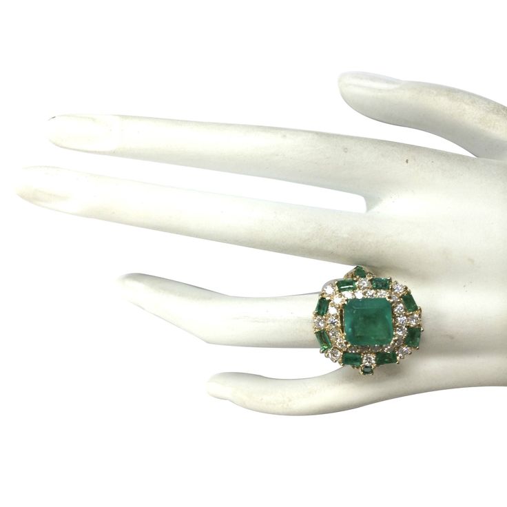 Stamped: 14K Yellow Gold Total Ring Weight: 12.3 Grams Ring Length: N/ARing Width: N/A Gemstone Weight: Total Natural Center Emerald Weight is 3.20 Carat (Measures: 9.00x9.00 mm) Quantity: 1 Color: Green Gemstone Weight: Total Natural Side Emerald Weight is 2.00 Carat Quantity: 12 Color: Green Diamond Weight: Total Natural Diamond Weight is 1.70 Carat Quantity: 42 Color: F-G, Clarity: VS2-SI1 Face Measures: 21.30x18.25 mm Sku: [702540W] Yellow Gold Diamond Ring, Gold Diamond Ring, Green Diamond, Green Gemstones, Gold Diamond Rings, Natural Emerald, Turquoise Ring, Natural Diamonds, Gold Diamond