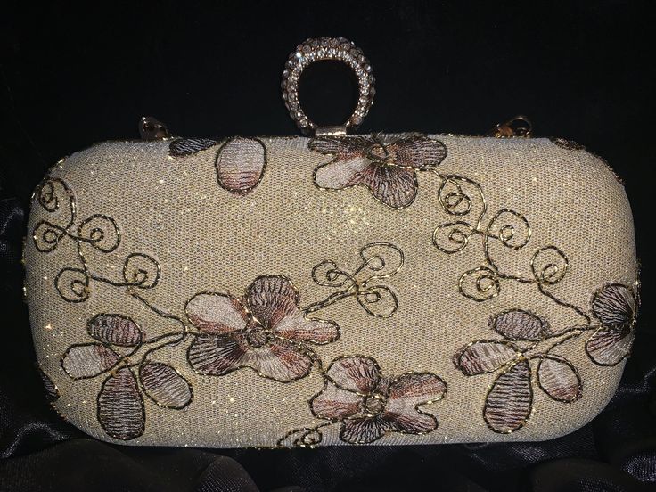 Elevate your style with our cream and purple floral clutch, a masterpiece of elegance and femininity. Perfect for both casual outings and special occasions, this clutch combines soft cream leather with delicate purple floral patterns, creating a harmonious blend of sophistication and charm. Crafted with meticulous attention to detail, each clutch features intricate floral embroidery or embossing, ensuring a unique and eye-catching design. The compact size makes it convenient to carry yet spaciou Feminine Beige Wedding Bags, Cream Rectangular Evening Bag, Chic Beige Embellished Evening Bag, Beige Embroidered Evening Bag For Events, Elegant Gold Evening Bag With Floral Embroidery, Elegant Cream Rectangular Evening Bag, Embellished Cream Rectangular Clutch, Embellished Beige Clutch Evening Bag, Elegant Floral Embroidered Clutch Evening Bag