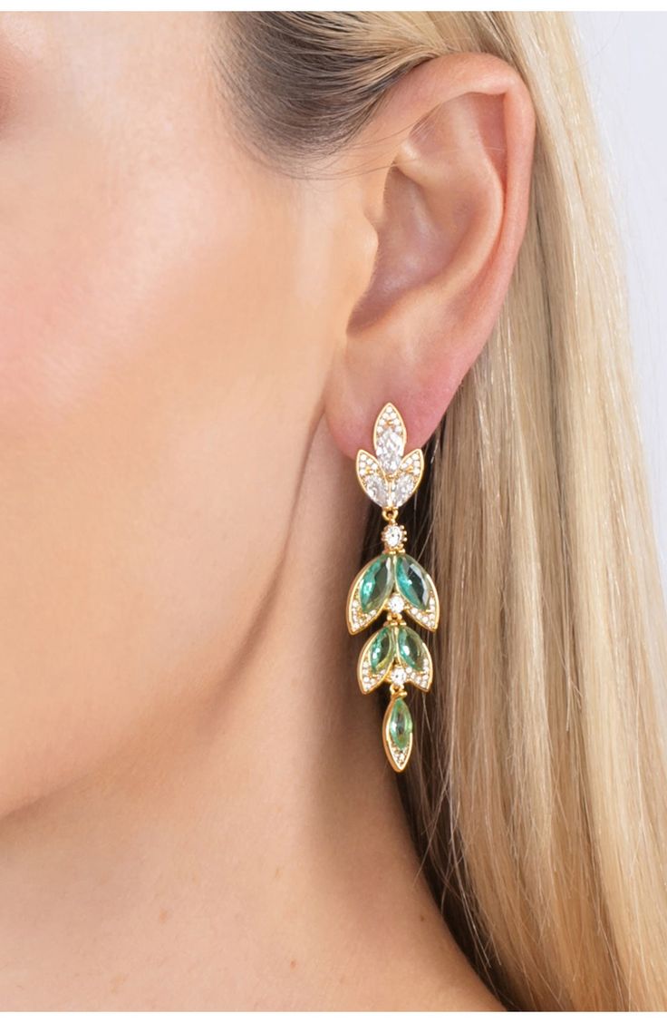 Clear cubic zirconia stones frame green marquis crystals to create these leaf inspired dangle earrings. Post back Brass/cubic zirconia Imported Elegant Green Leaf-shaped Jewelry, Elegant Green Marquise Earrings, Elegant Green Leaf-shaped Earrings, Earrings In Gold, Statement Earrings, Eye Candy, Cubic Zirconia, Dangle Earrings, Angeles