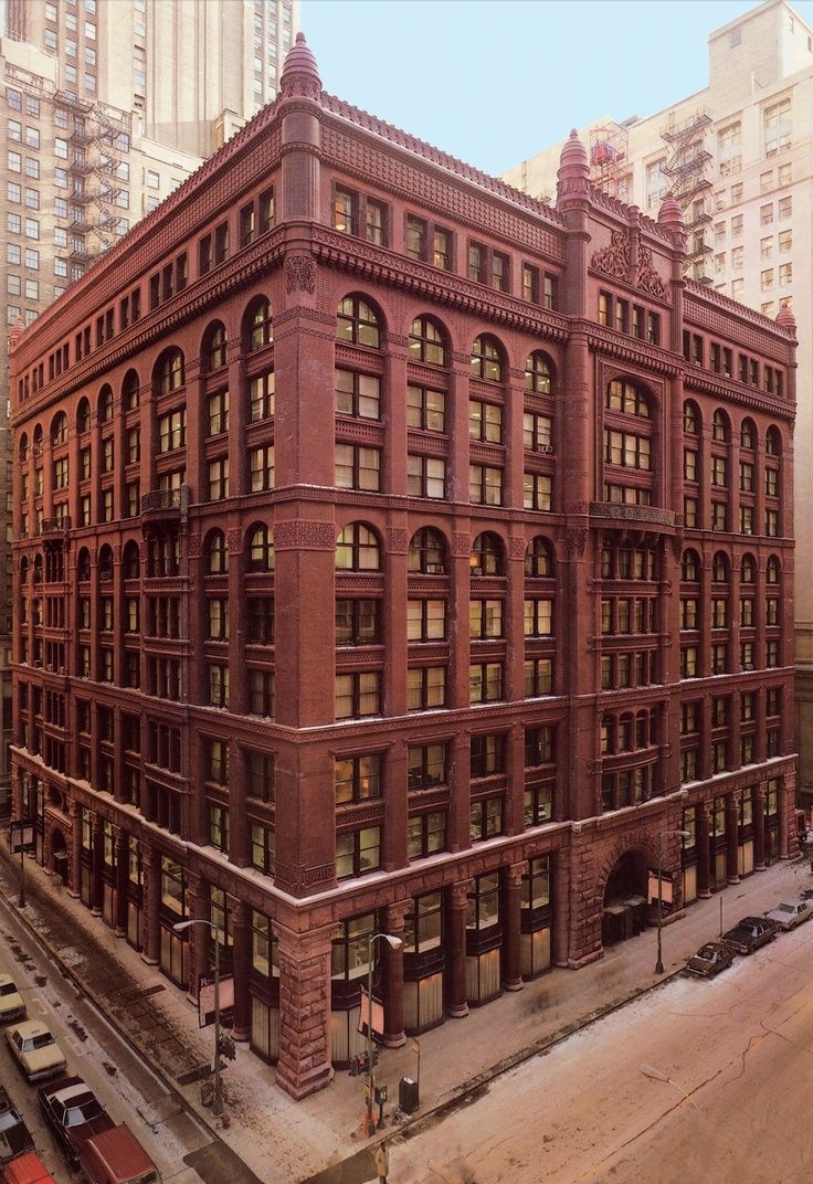 an old red brick building with many windows