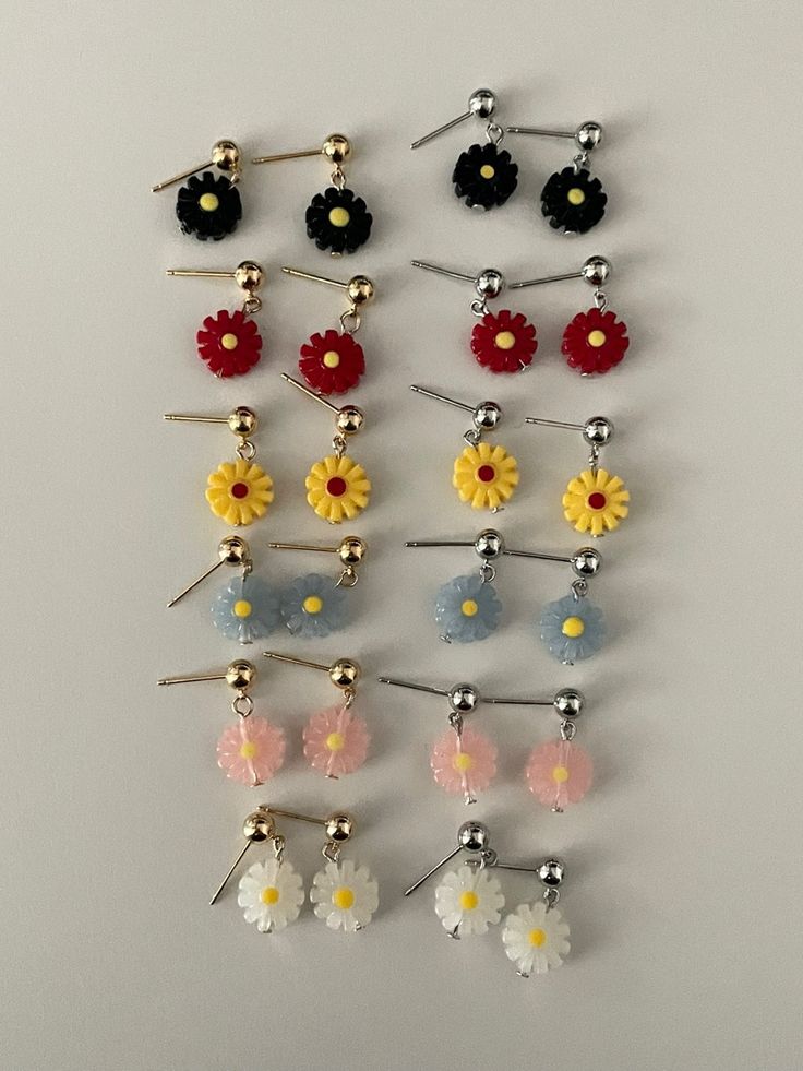 Fun, quirky, and full of personality - these acrylic resin dangle earrings feature charming daisy flowers and come in your choice of gold or silver earring posts. Choose your preferred flower dangle color to add a touch of playfulness to any outfit.- Stainless steel, Acrylic Resin- Daisy: 10x10mm- Stud ball: 4.8mm Trendy 3d Flower Earrings For Spring, Dangle Flower Earrings With 3d Flowers, Trendy Silver Flower Earrings, Trendy White Earrings With Flower Charm, Dainty 3d Flower Earrings, Trendy 3d Flower Earrings, Cute Daisy Shaped Flower Earrings For Gifts, Cute Daisy Flower Earrings For Gift, Trendy 3d Flower Jewelry