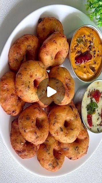 a white plate topped with doughnuts and dip