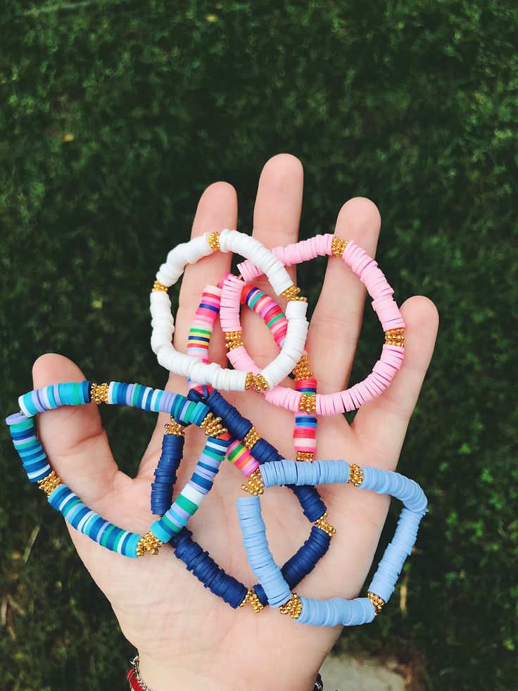 These heishi beaded bracelets are fun, colorful, and great for any outfit. They go by several names, including Heishi beads, Pukka beads, or African Vinyl beads. Made on stretchy string. Please message me if you would like a mix of the colors listed! :) Sizing tip: my wrist (shown in the picture) fits best with a 6.5 inch bracelet. Another fun colorful shell bracelet: https://www.etsy.com/listing/819302320/cowri-shell-beaded-bracelets-painted?ref=shop_home_feat_2&pro=1&frs=1 Pukka bracel Bracelet Heishi, Bracelets Heishi, Letter Bracelets, Aesthetic Bracelet, Heishi Bracelets, Colorful Bead Bracelets, Preppy Bracelets, Name Bracelets, Flat Beads