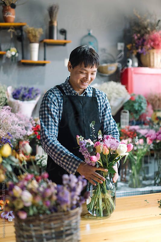 a florist arranging flowers in a flower shop