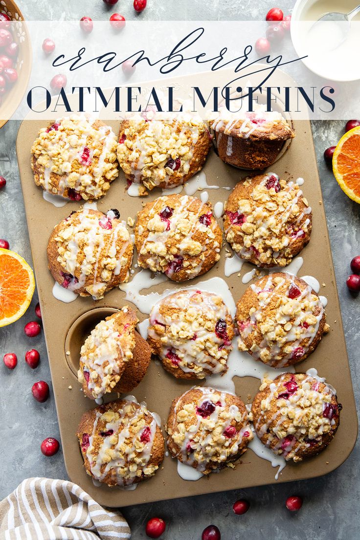 orange cranberry oatmeal muffins with icing on a tray