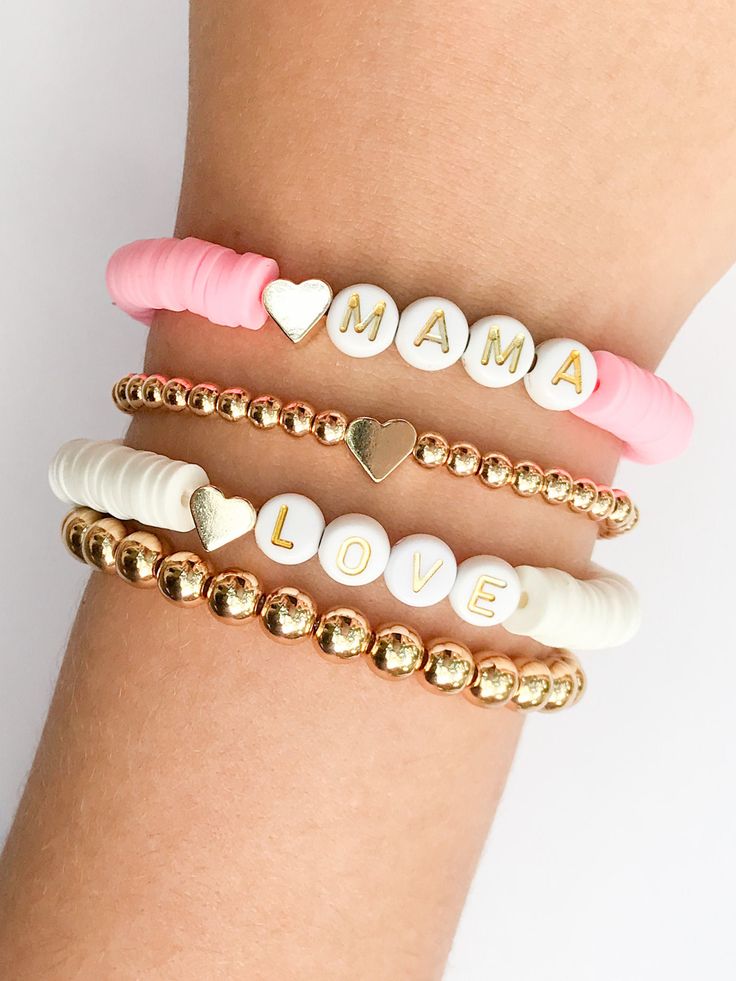 "These bracelets are so cute! I just love them all. Thus listing is for your choice of one bracelet in the photo. Choose from the pink MAMA bracelet, the LOVE bracelet or 4mm beaded bracelet with the gold heart in the center or the 6mm solid beaded bracelet without a charm. Add them together for a stacked look You can also customize your own bracelet. Just leave a note at checkout with your word, phrase or name. The letters for these bracelets in this listing are for the white beads with the gol Trendy Heart Charm Bracelets For Mother's Day, Trendy Mother's Day Bracelets With Heart Charm, Trendy Heart Beads Bracelets For Mother's Day, Trendy Heart Beads Bracelet For Mother's Day, Trendy Heart-shaped Bracelet With Letter Beads, Trendy Heart-shaped Bracelets With Letter Beads, Adjustable Heart-shaped Stackable Bracelets, Trendy Name Bracelet For Valentine's Day, Trendy Hypoallergenic Bracelet For Valentine's Day