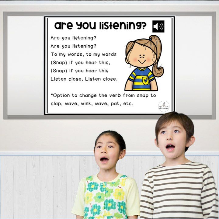 two young children standing in front of a poster with the words are you listening?