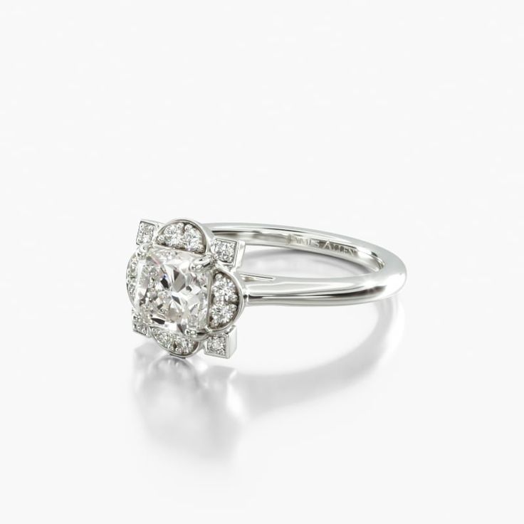 a white gold ring with two diamonds on the top and bottom, set in 18k white gold