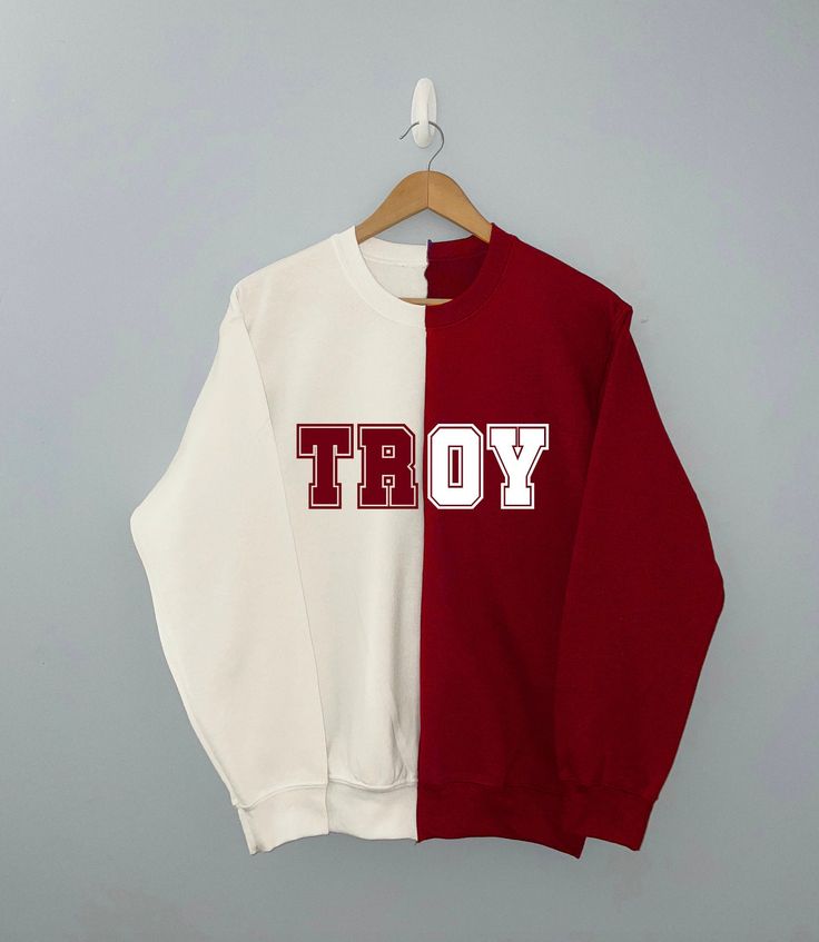 A duo red/white sweatshirt with TROY or wording. *3 WEEK TURNAROUND DUE TO HANDMADE ITEM *Shirt colors maybe switched from above images White T-shirt With Ribbed Cuffs For College, White Long Sleeve Sweatshirt With School Spirit, White Oversized Sweatshirt With School Spirit, White College Style Tops With Ribbed Cuffs, White Oversized Sweatshirt For Sports Season, White Varsity Top With Ribbed Cuffs, White Oversized Varsity Sweatshirt, Oversized White Varsity Sweatshirt, White School Spirit Sweatshirt With Ribbed Cuffs