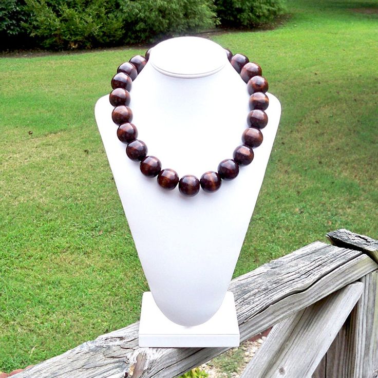 Chunky Wood Necklace Large Wood Necklace Big Wood Bead Necklace Bohemian Necklace Boho Necklace 25mm Round Dark Brown Wood Bead Necklace This modern beauty was hand beaded using large and chunky 25mm round deep brown wooden beads. The necklace measures your choice of 22, 25, 30, or 38 inches long and is securely fastened with a silver clasp. The end result is a chic bohemian piece that fits in perfectly with today's fashion trends! Length can be adjusted if needed - just ask! Check out more fabu Wooden Beads Necklaces For Jewelry Making, Round Wooden Beads Necklaces For Jewelry Making, Brown Polished Bead Round Necklaces, Brown Polished Beads Round Necklace, Brown Necklaces With Polished Beads, Necklace Big, Wood Bead Necklace, Chic Bohemian, Wooden Necklace