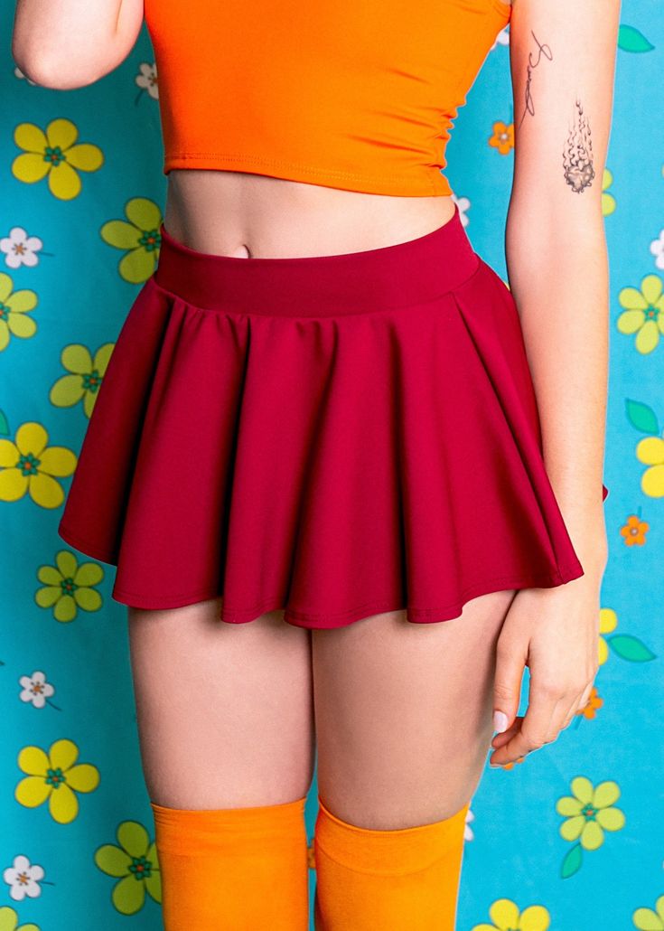 Look sharp and smart with the Brains of the Mystery Gang Skirt. The bold burgundy color exudes confidence, while the mini length adds a touch of playfulness. Channel your inner nerdiness with this flirty skirt! Made of 4-way stretch Dri-tex, which is easy to clean, durable, and fade-resistant making it the perfect outfit for everyday fashion! This skirt is 9 inches long from the waistband. In stock items will ship within 2-4 business days. Sugarpuss Size Chart + Care Instructions Shipping Info Superhero And Villain Costumes, Mystery Gang, Mini Circle Skirt, Outfit For Everyday, Barbie Costume, School Vibes, Retro Tops, Pink Doll, Hero Costumes