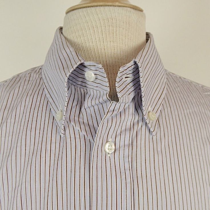 Loro Piana 100% Cotton Shirt..Made In Italy Size 18, .Button Front ..Button Cuffs And Button Down Collar..Blue Gray And Brown Fine Stripes Condition: Mint Measures Length 32.5 Shoulder 20 Sleeve 22.5 Underarm To Underarm 24 Semi-formal Button-up Shirt With Extra Button, Business Casual Shirt With Collar And Buttons, Business Casual Collared Dress Shirt, Office Shirt With Buttons And Fold Down Collar, Office Shirt With Spread Collar And Buttons, Office Shirt With Spread Collar, Semi-formal Button-up Dress Shirt, Business Shirt With Buttons And Spread Collar, Business Shirt With Spread Collar And Buttons