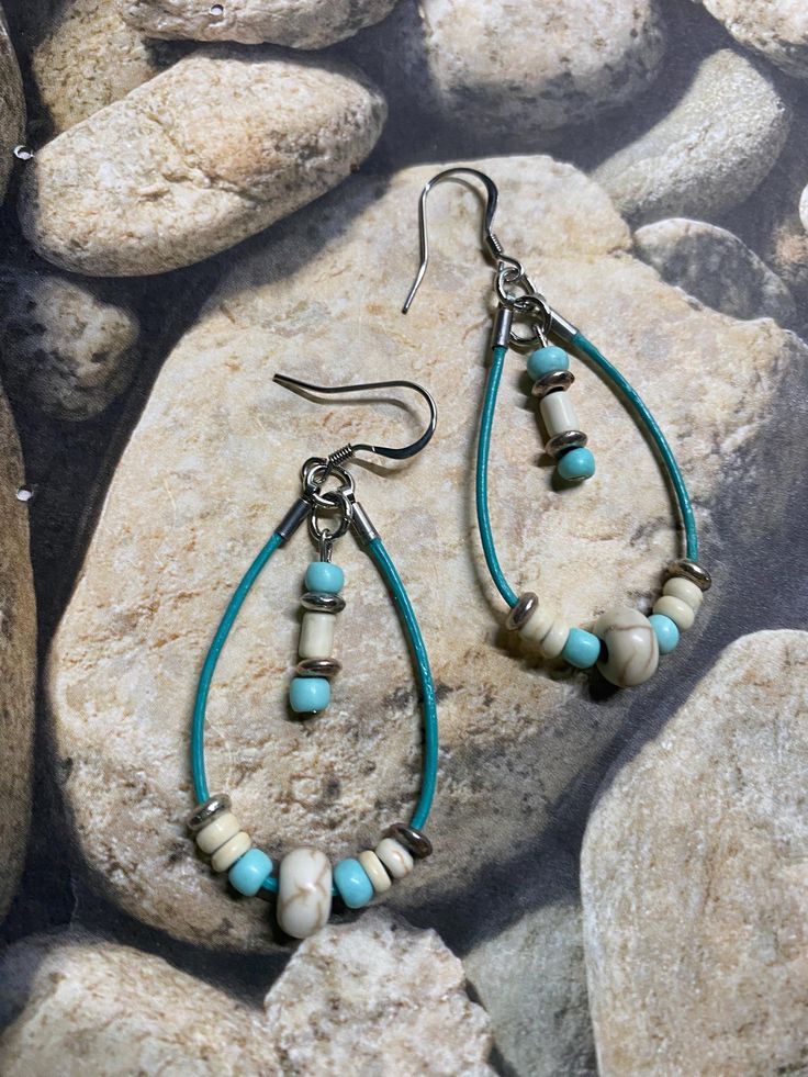 Add these lightweight leather earrings to your summer wardrobe and get noticed! I used various beads for a beachy vibe. Summer or year round, these hoops will make any outfit feel perfect Size: 2 inch drop approximately and .75 inch wide approximately Adjustable Beaded Earrings With Dangling Beads For Beach, Turquoise Beaded Beach Earrings, Turquoise Hoop Earrings For Beach, Beaded Earrings With Ear Wire For Beach, Adjustable Beaded Earrings With Ear Wire For Beach, Bohemian Nickel-free Hoop Earrings For Beach, Nickel Free Teardrop Beaded Earrings For Beach, Bohemian Beaded Hoop Earrings For Beach, Nickel-free Teardrop Beaded Earrings For Beach